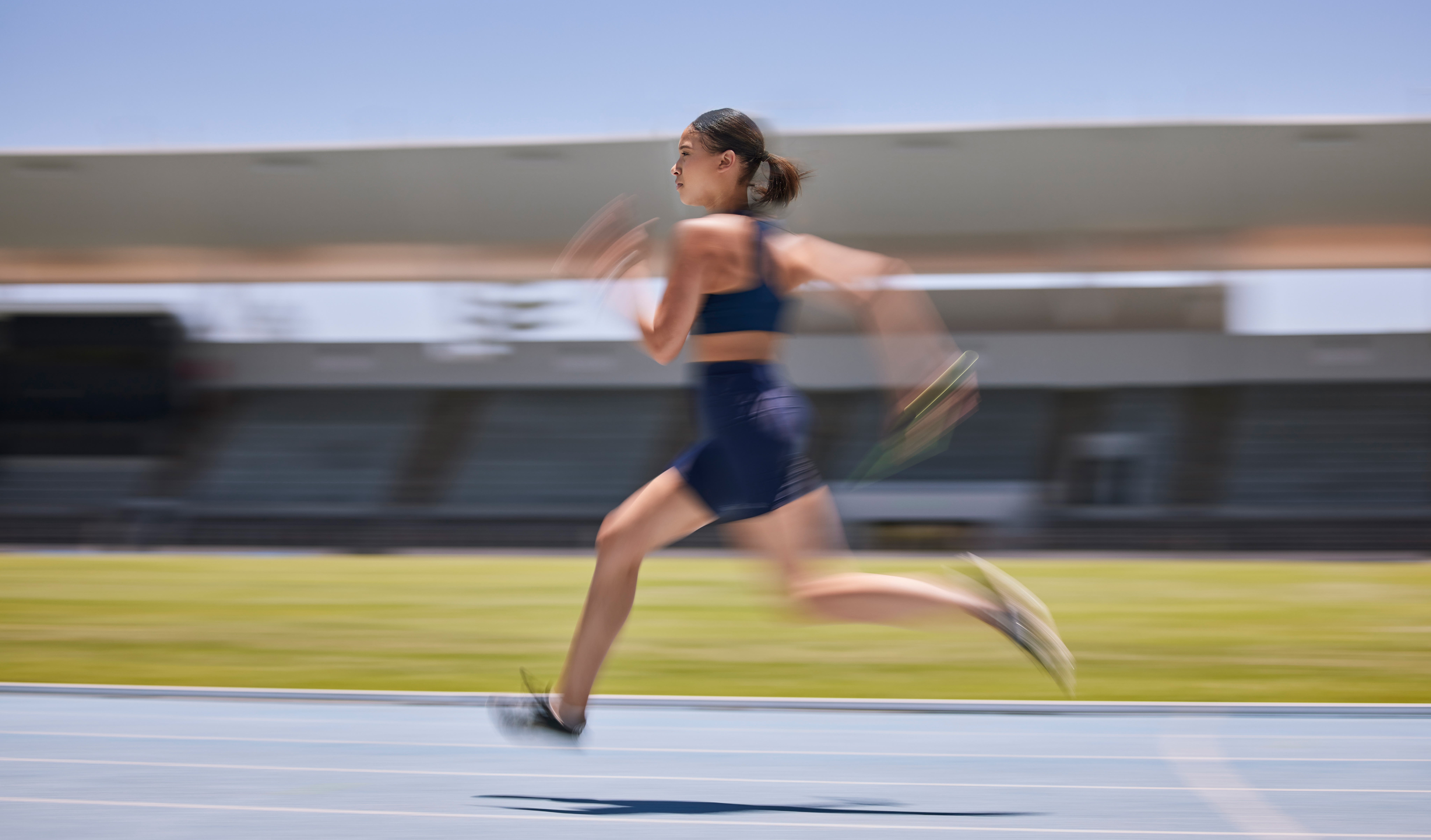 woman motion blur or running on stadium track in 2023 11 27 05 03 00 utc